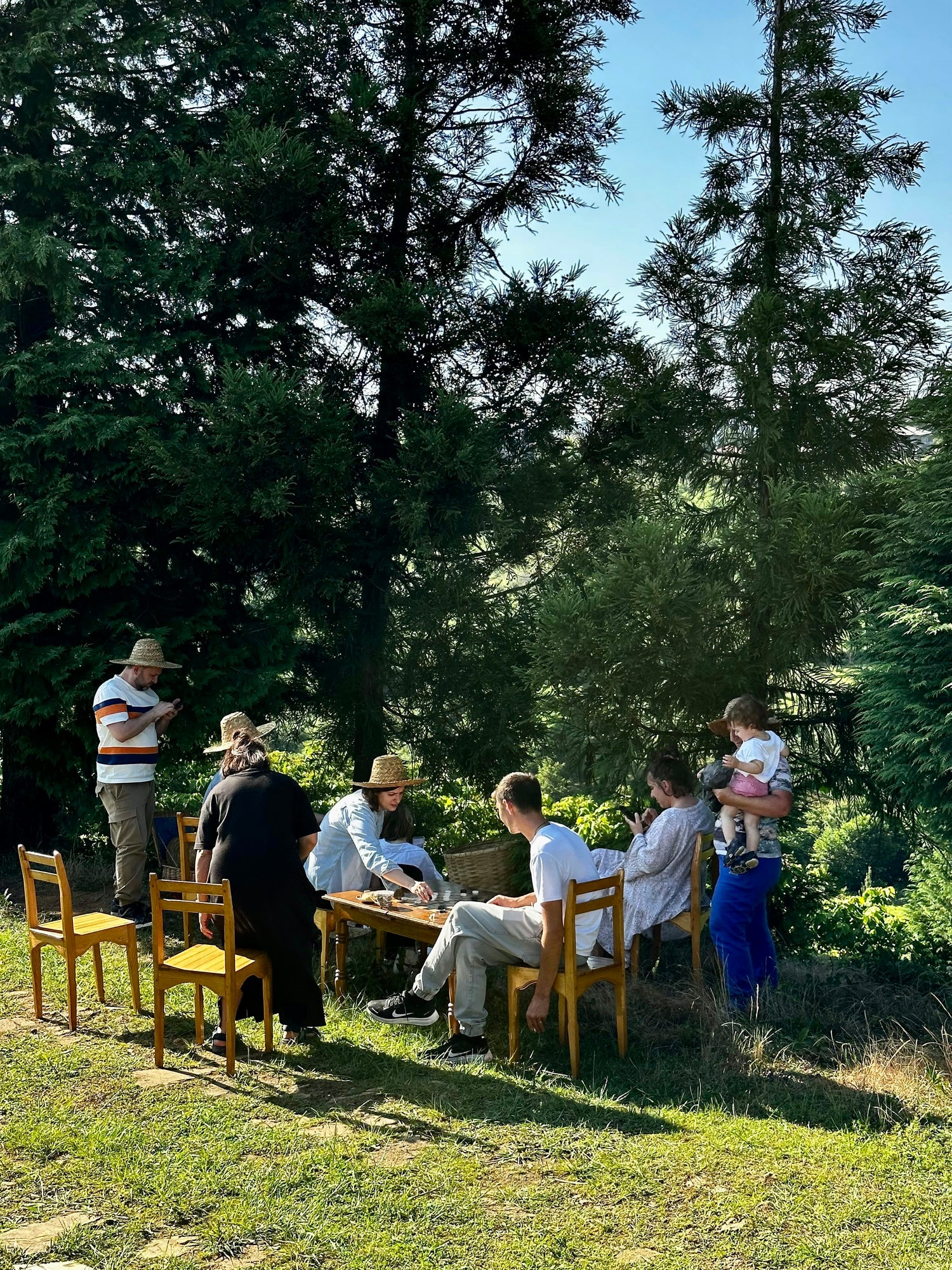 Travelers gathering around a shared outdoor table